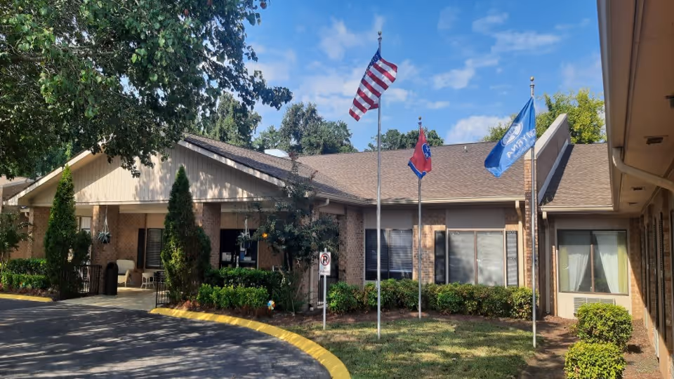 Diversicare of Smyrna exterior with flags, shrubs, and entrance.