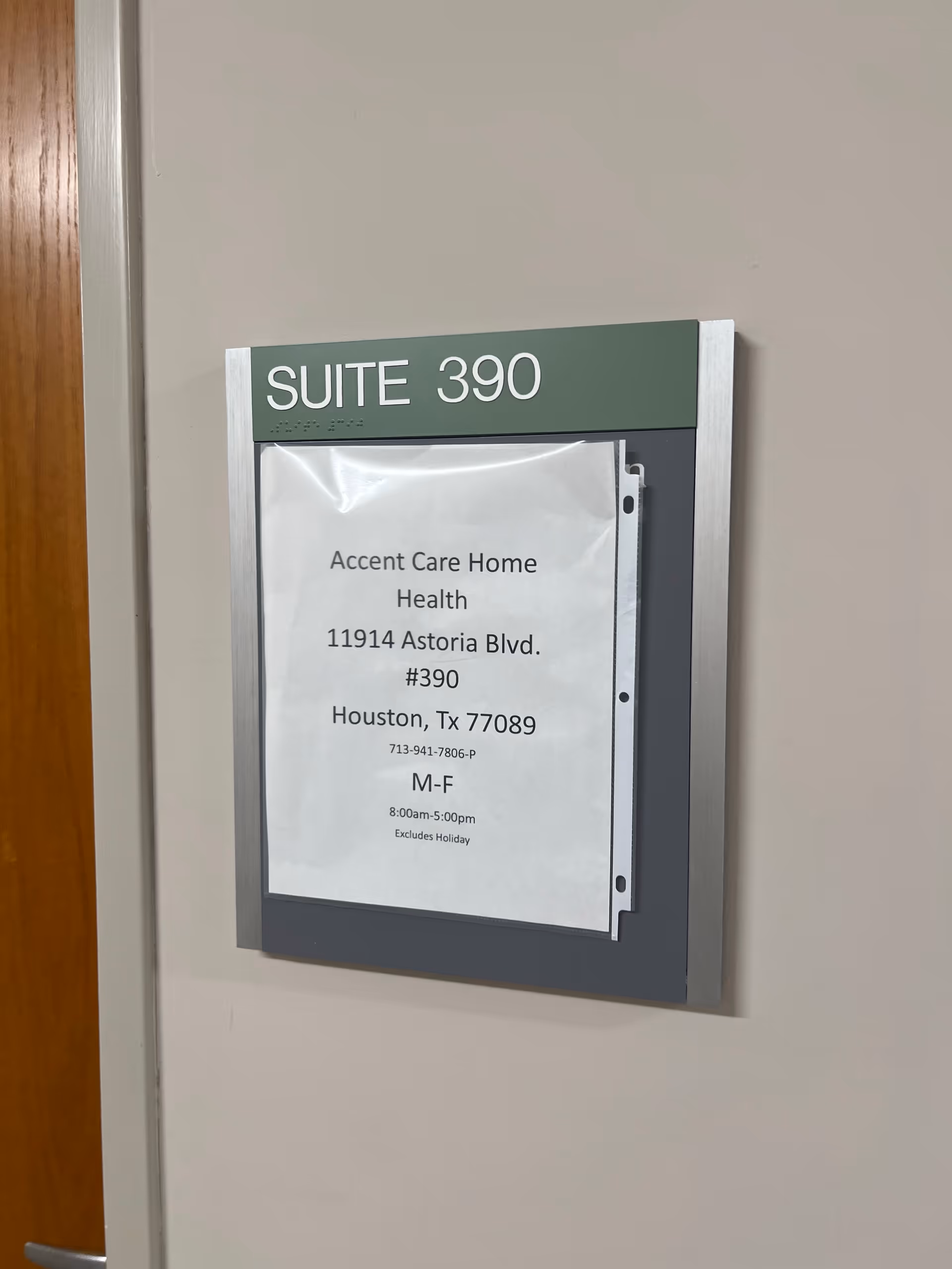 Interior hallway wall featuring Suite 390 sign with Accent Care Home Health notice.