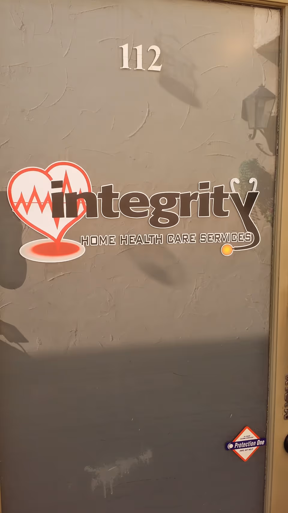 Front door of Integrity Home Health Care Services with 112.