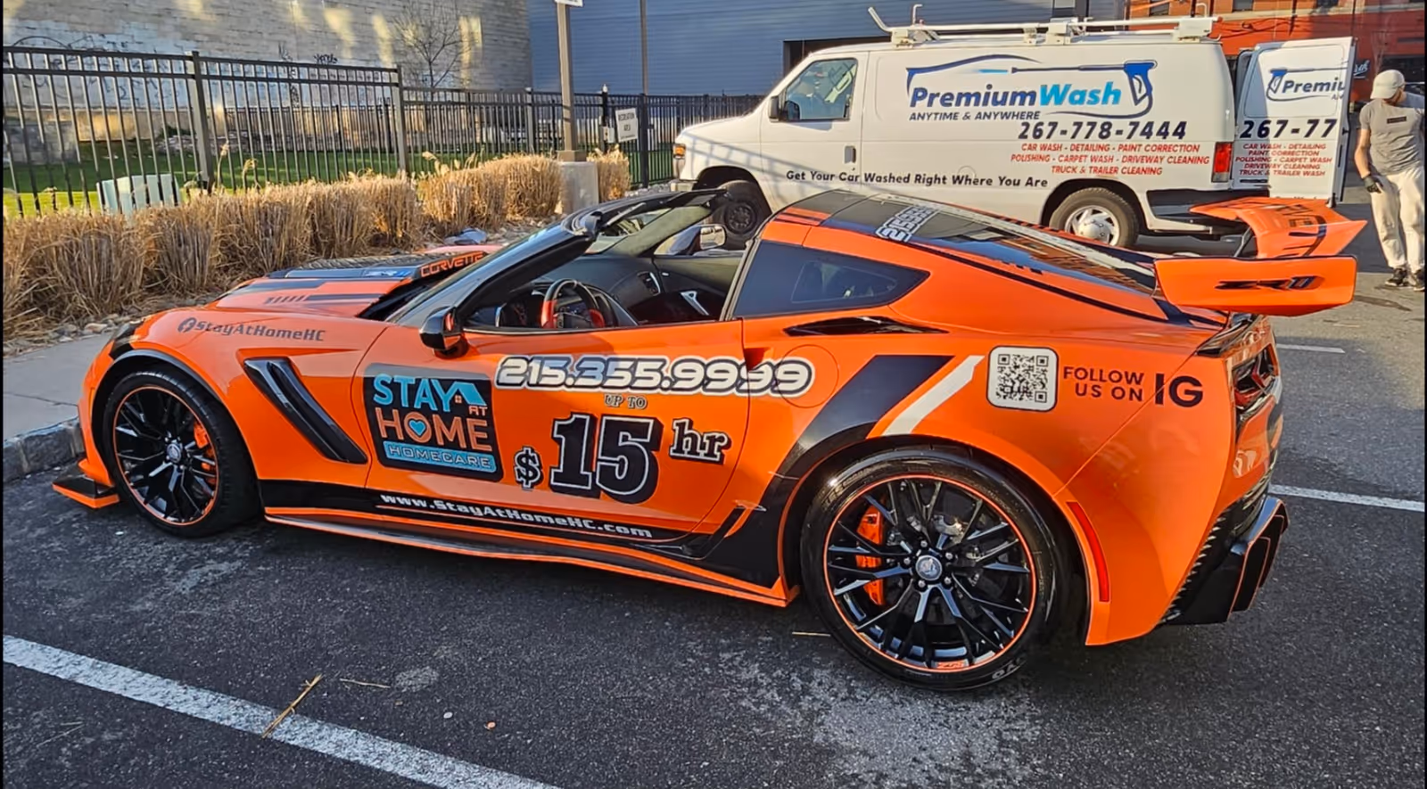Bright orange Stay at Home Homecare promotional sports car parked in a lot