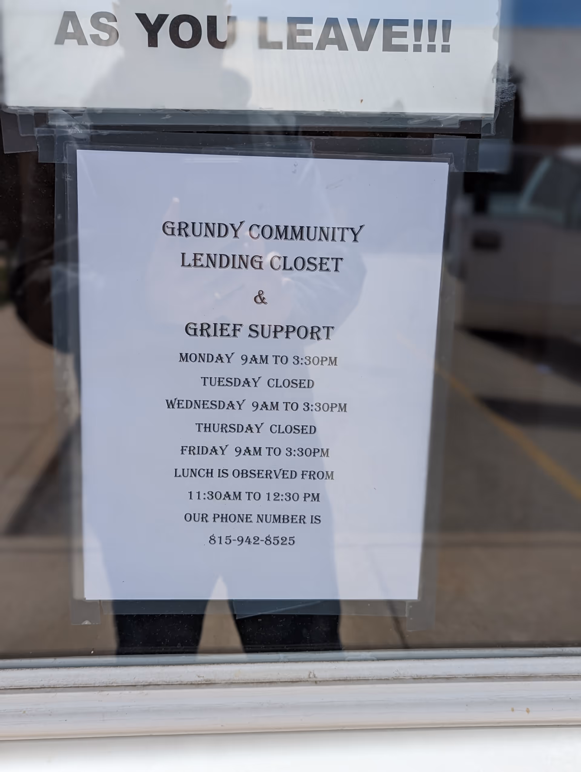 Window with notices about Grundy Community Lending Closet and Grief Support services.