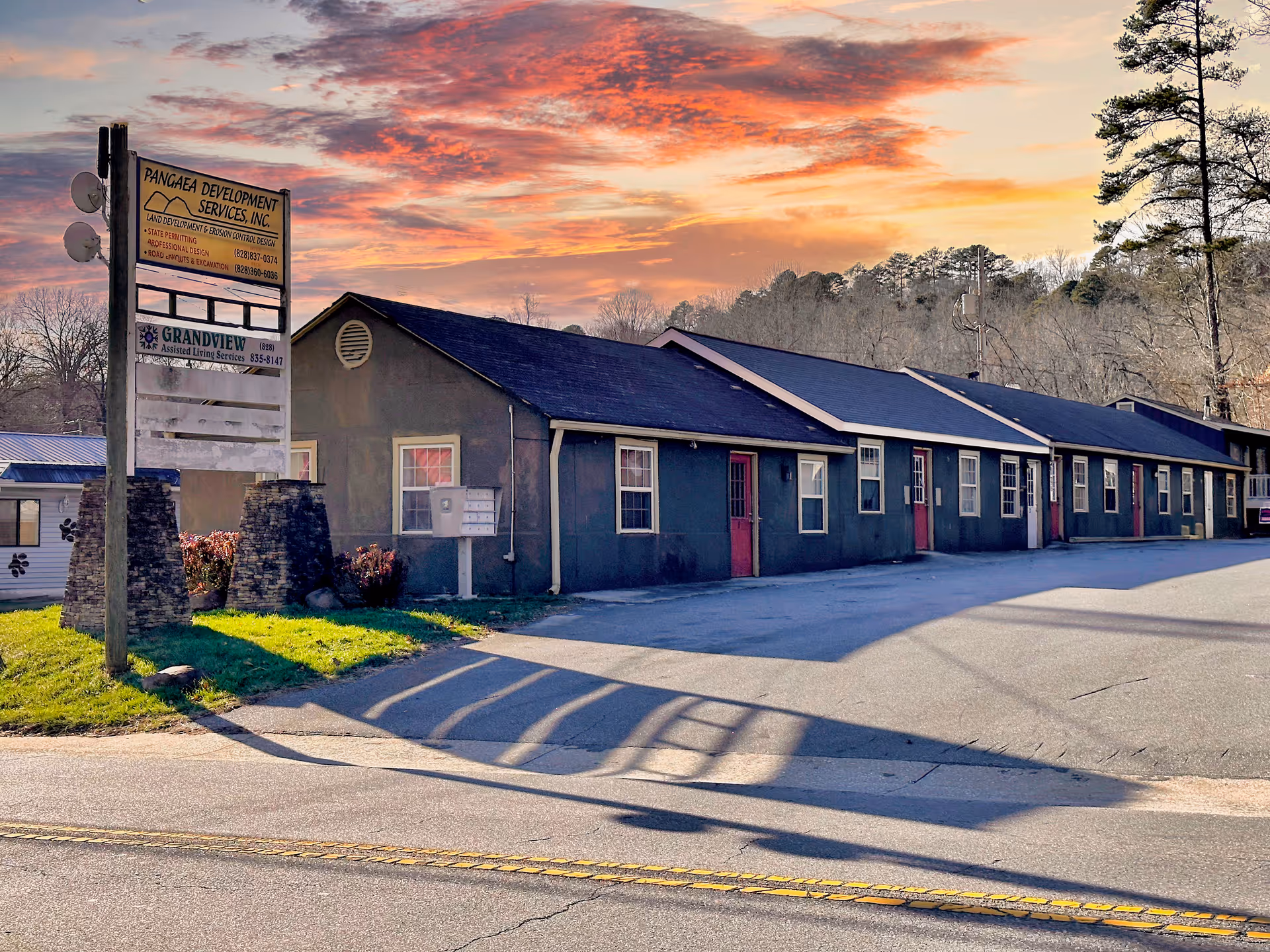 Exterior view of Grandview Assisted Living Services facility with a row of unit doors.