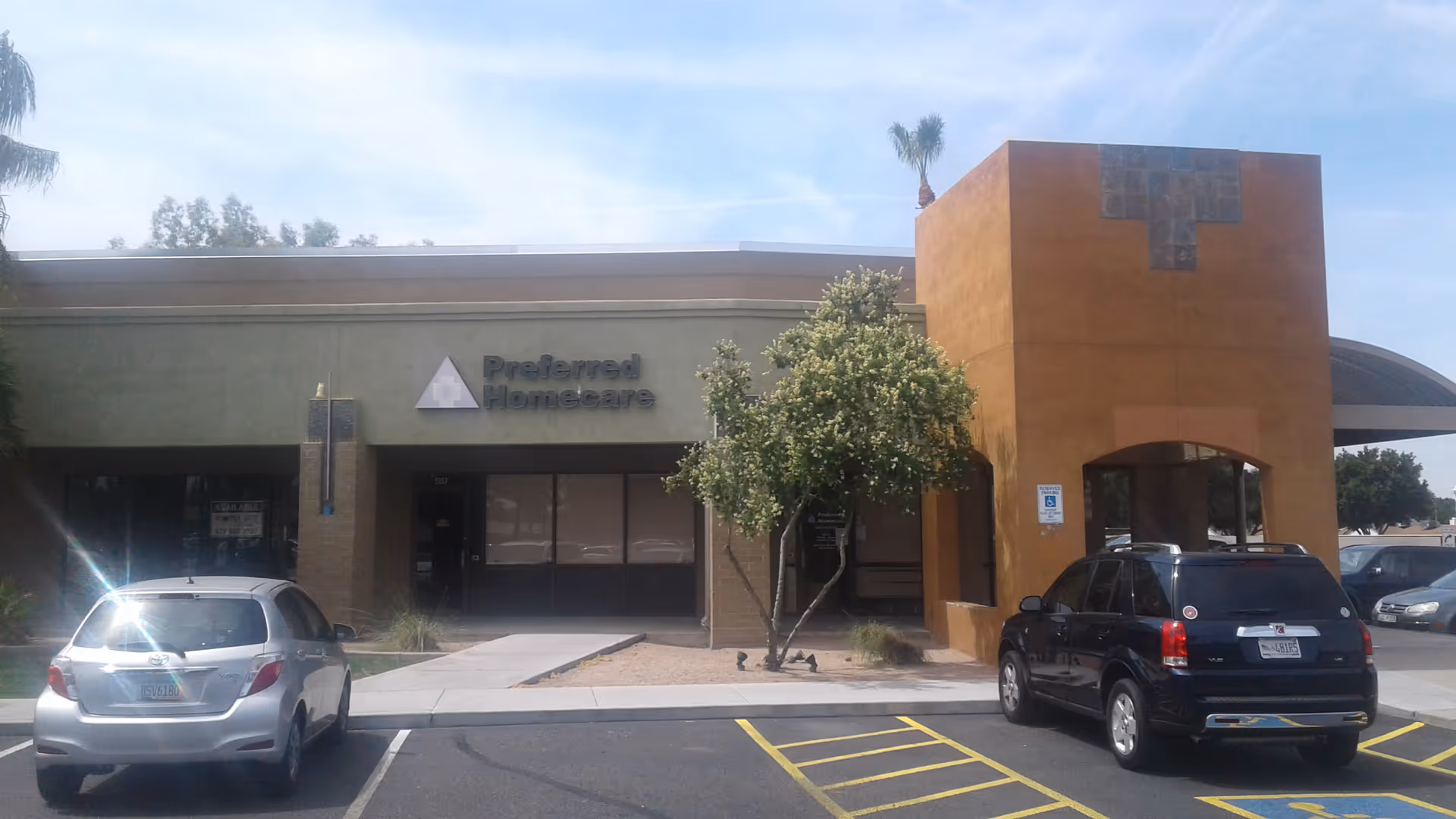 Front view of Preferred Homecare Glendale facility with parked cars outside.