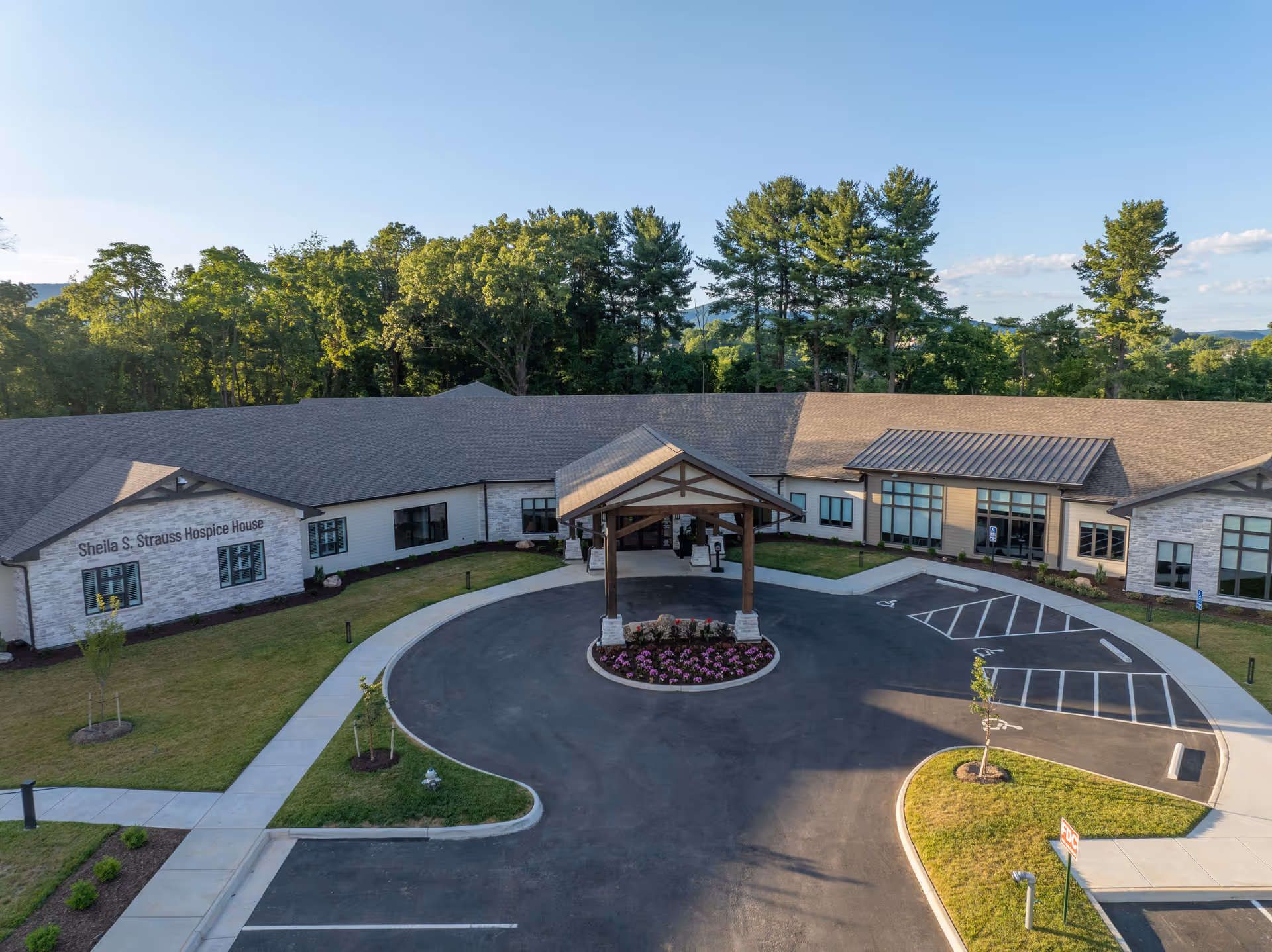 Exterior view of Sheila S. Strauss Hospice House with a circular driveway.