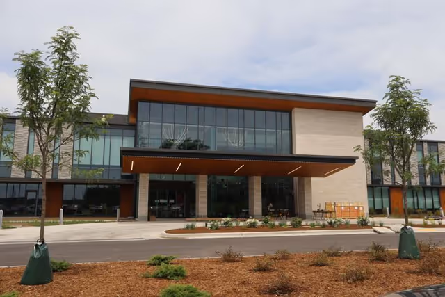 SSM Health Outpatient Center exterior with glass entrance and landscaped front drop-off area.