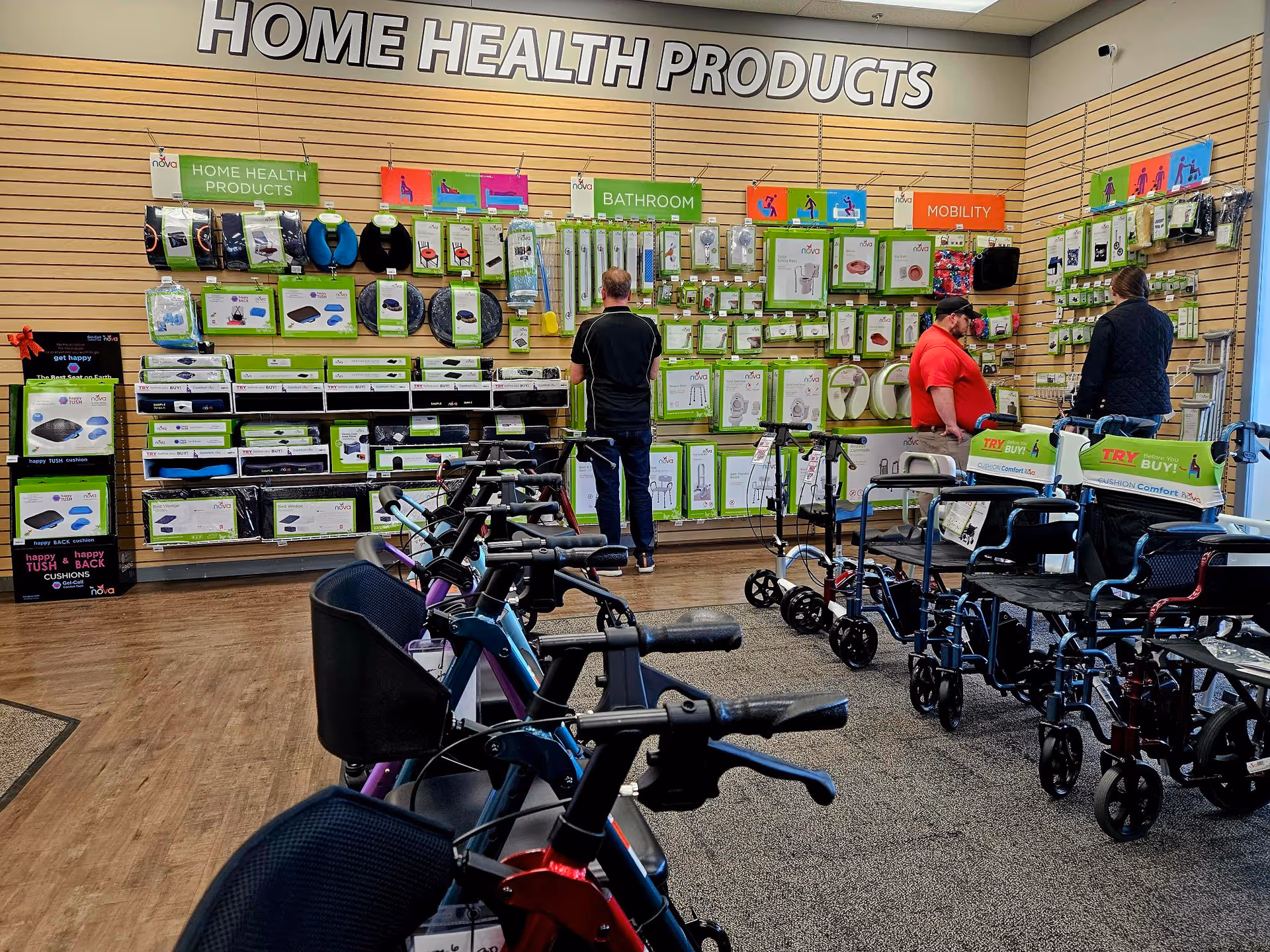 Inside a mobility equipment showroom displaying walkers, wheelchairs, and home health product displays.