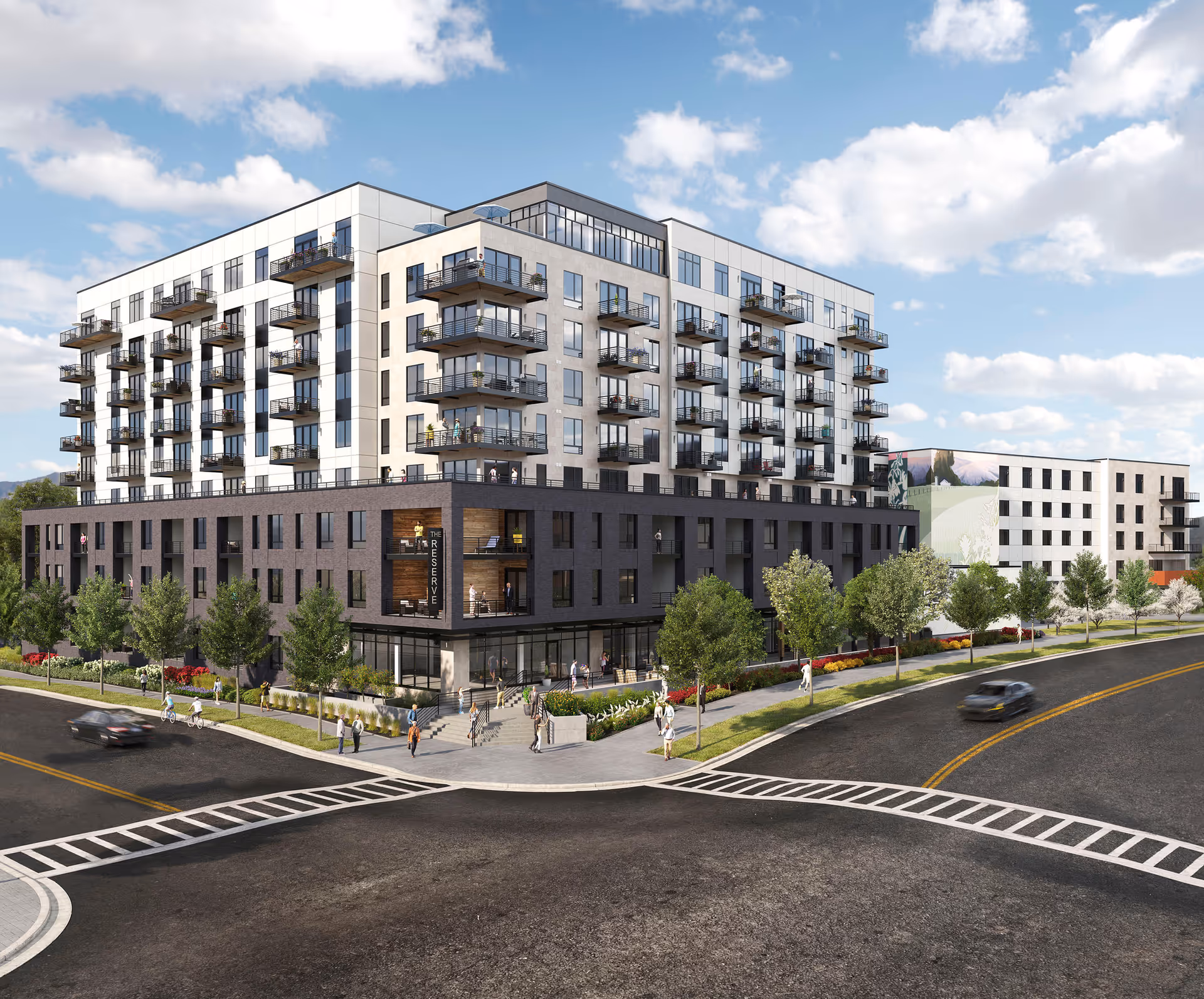A modern, multi-story senior living building with balconies and landscaped street frontage.