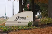 Grace Healthcare of Cordova entrance sign with landscaping and autumn mulch.