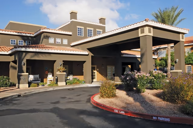 Exterior view of Brookdale Chandler Regional with a covered entrance and landscaped driveway.