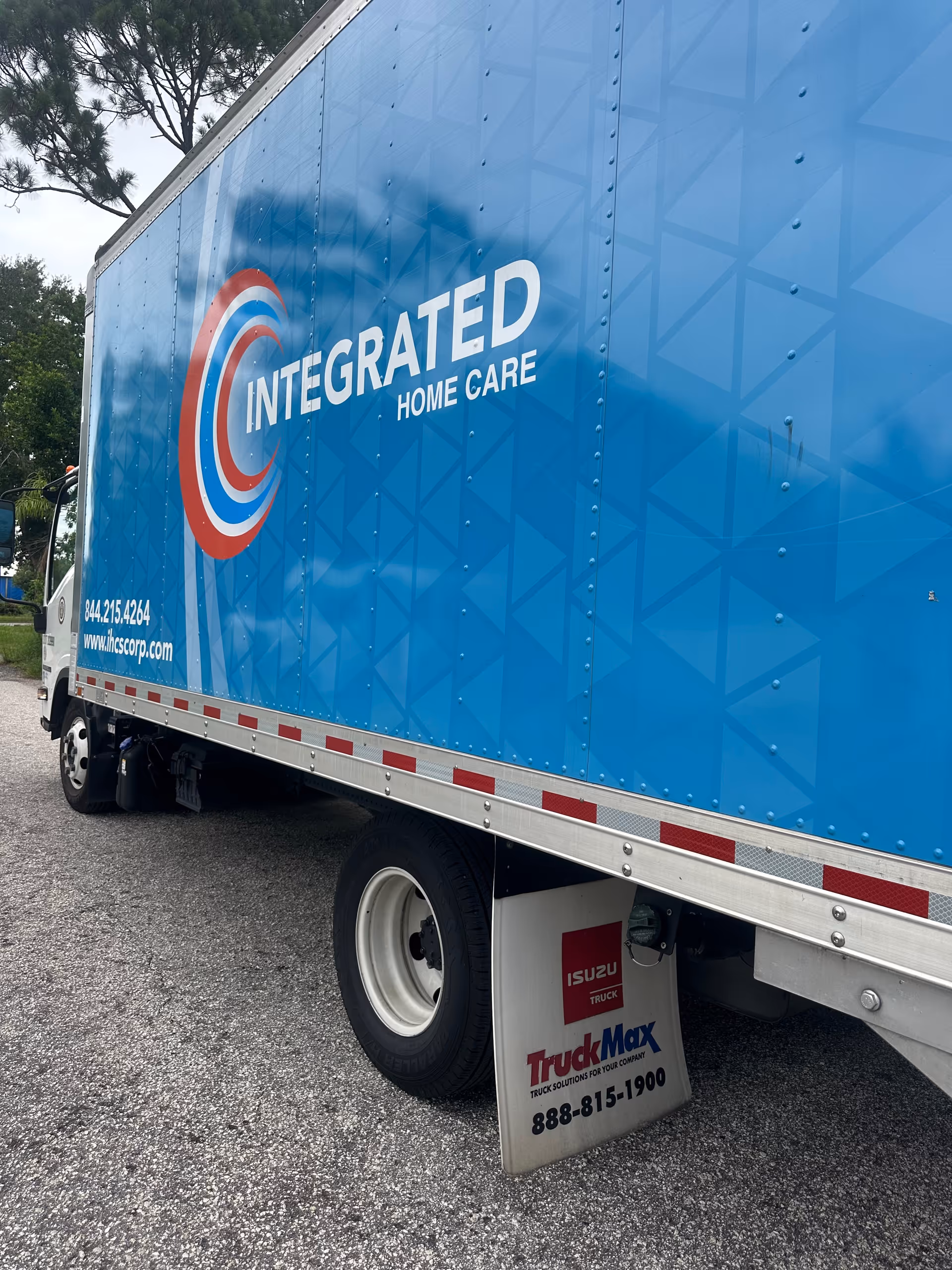 Blue truck with Integrated Home Care branding parked on a street.