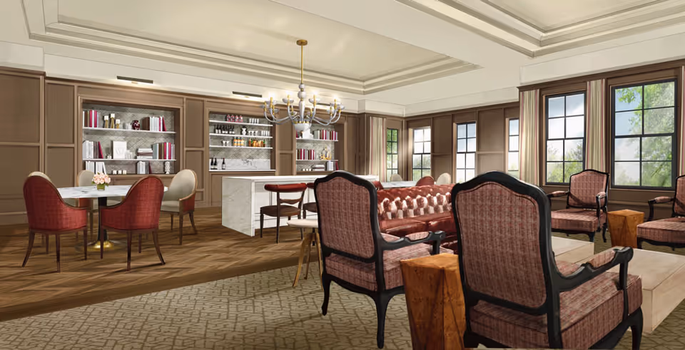 Luxurious senior living lounge with tufted seating, bookshelves, chandelier, and large windows.