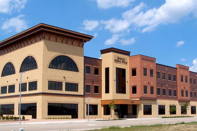 Exterior view of Achieve Healthcare, LLC senior living facility building.