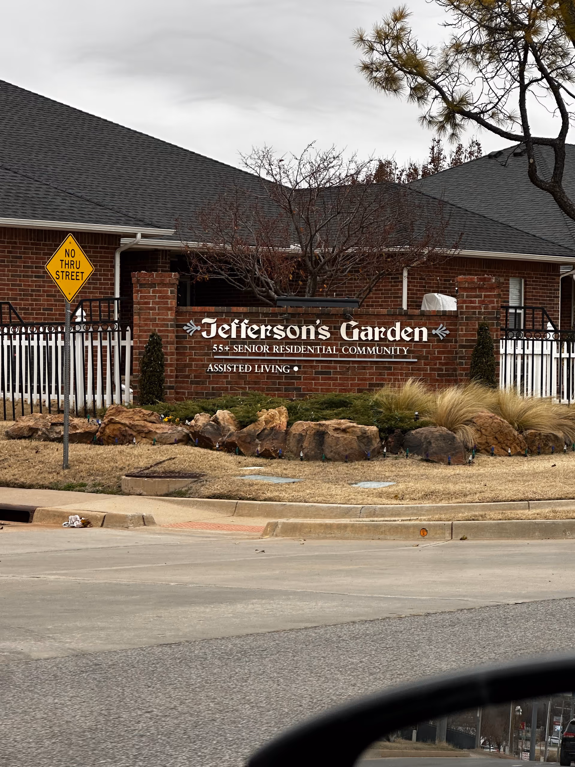 Exterior view of Jefferson's Garden senior living community entrance sign.