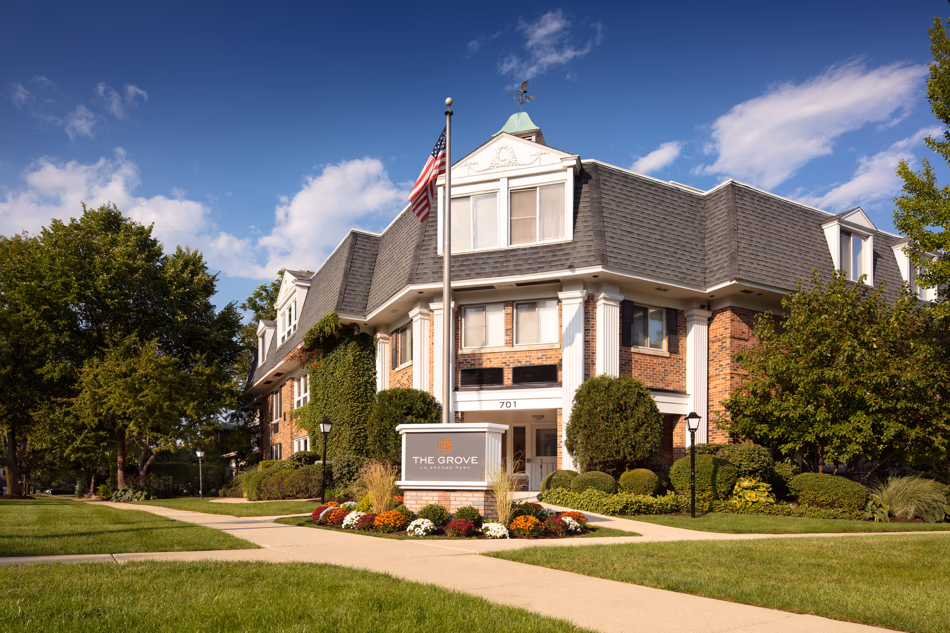 Grove of Lagrange Park senior living building with manicured landscaping and a front sign.