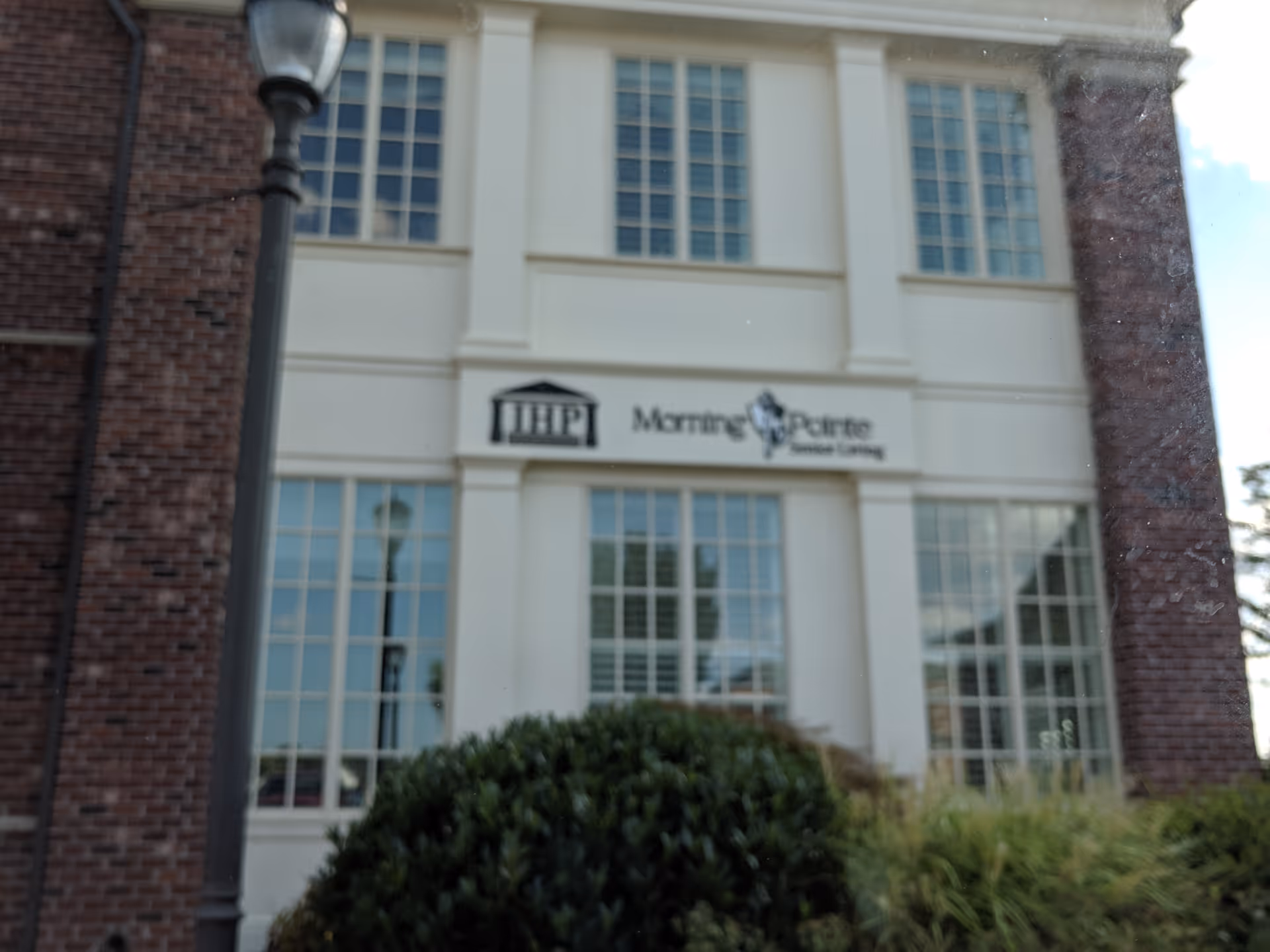 Morning Pointe Senior Living corporate office exterior with sign and brick walls.
