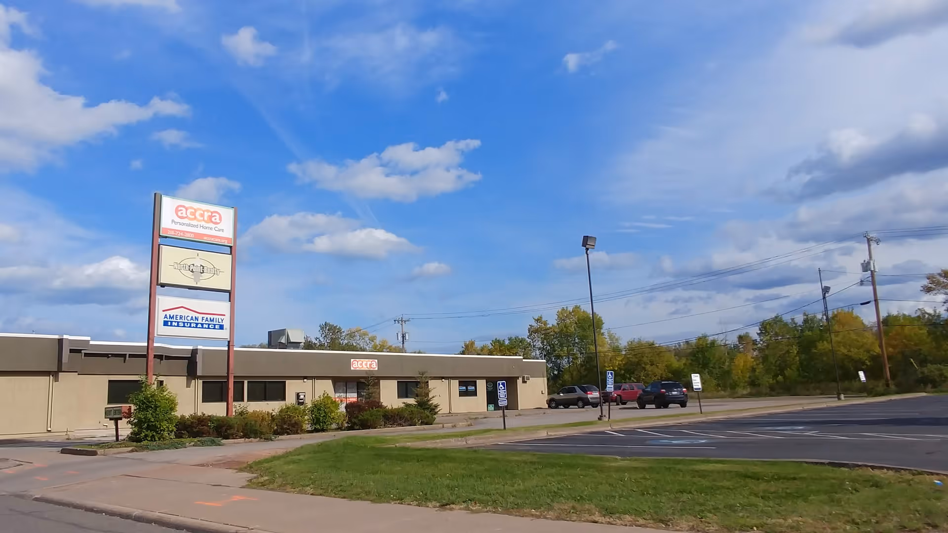 Exterior view of Accra Home Care Duluth building with signage and parking lot.
