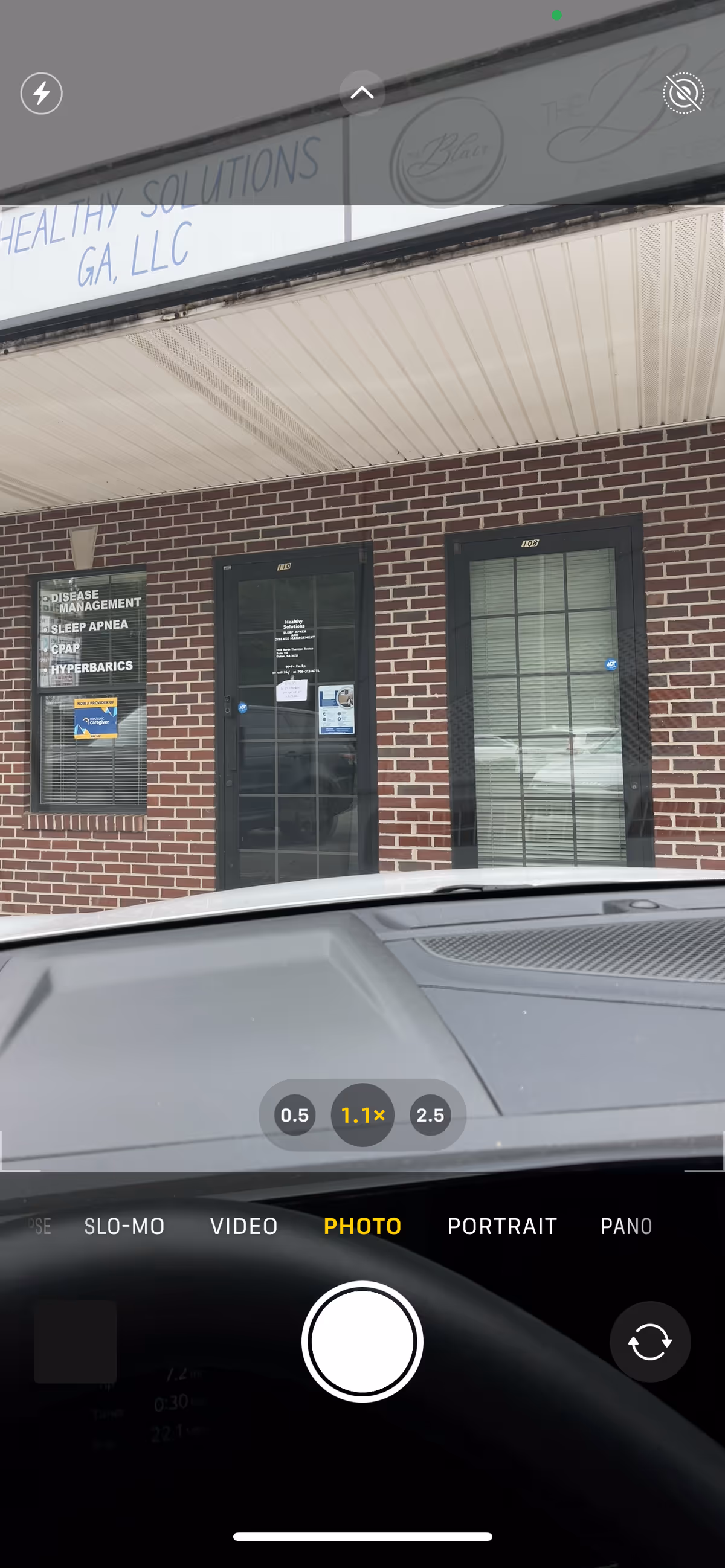 Brick storefront with glass doors, windows, and a sign reading Healthy Solutions GA, LLC.