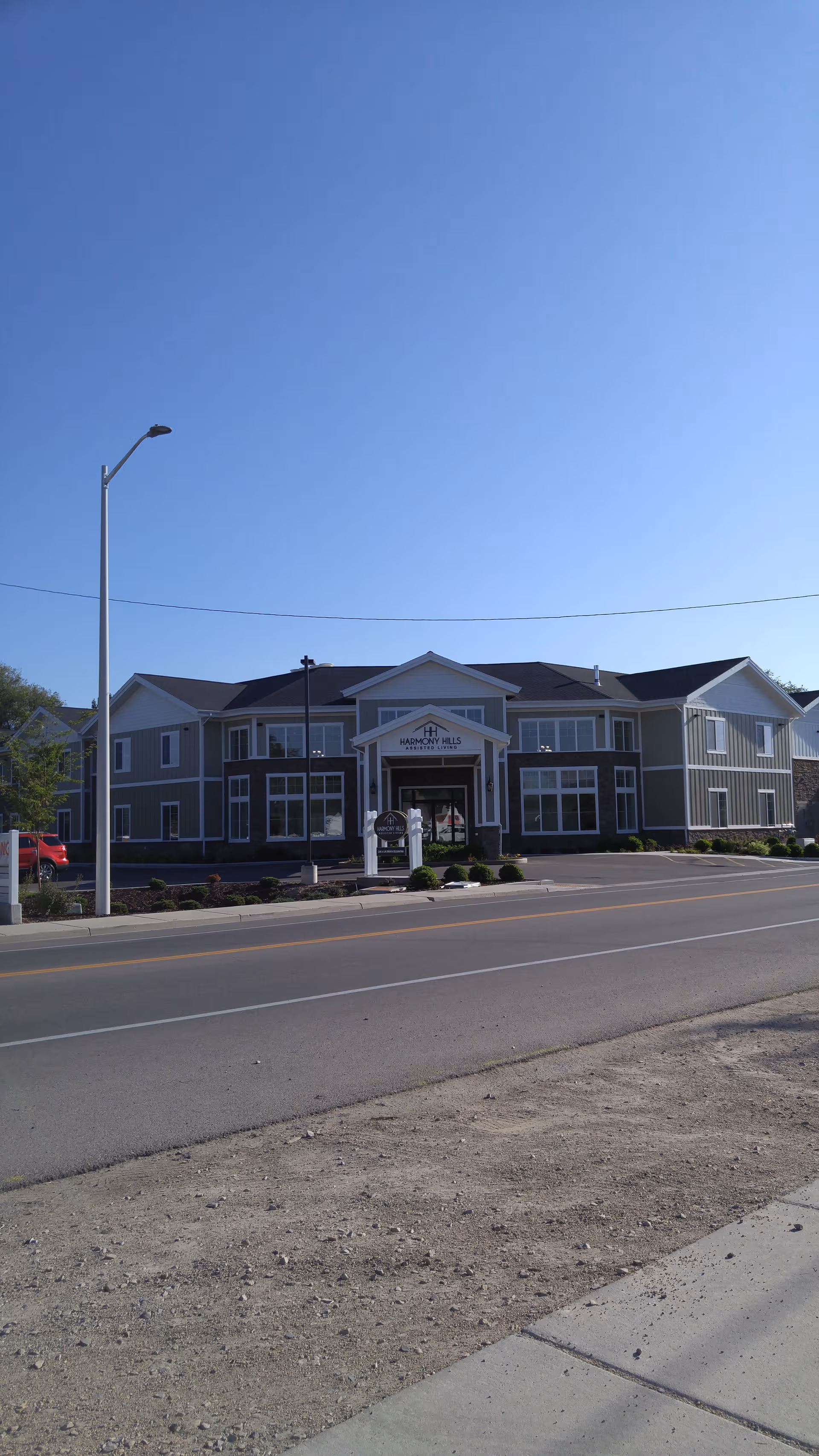 Exterior view of Aspen Ridge Residences of Lehi building with entrance
