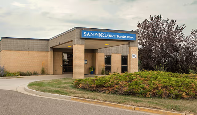 Front view of Sanford North Mandan Clinic entrance with landscaping.