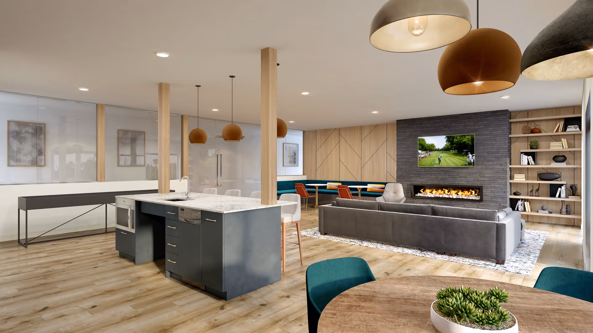 A modern open-concept living area featuring a kitchen island with a granite countertop and built-in appliances, pendant lights hanging above, a cozy seating area with a gray sectional sofa facing a wall-mounted TV above a linear fireplace, wooden shelves with decorative items, and a round dining table with green chairs and a succulent centerpiece.