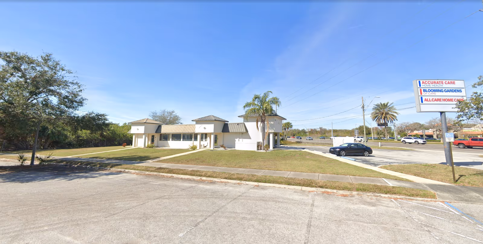 Exterior view of a small Accurate Care Home Health LLC facility with a parking lot.