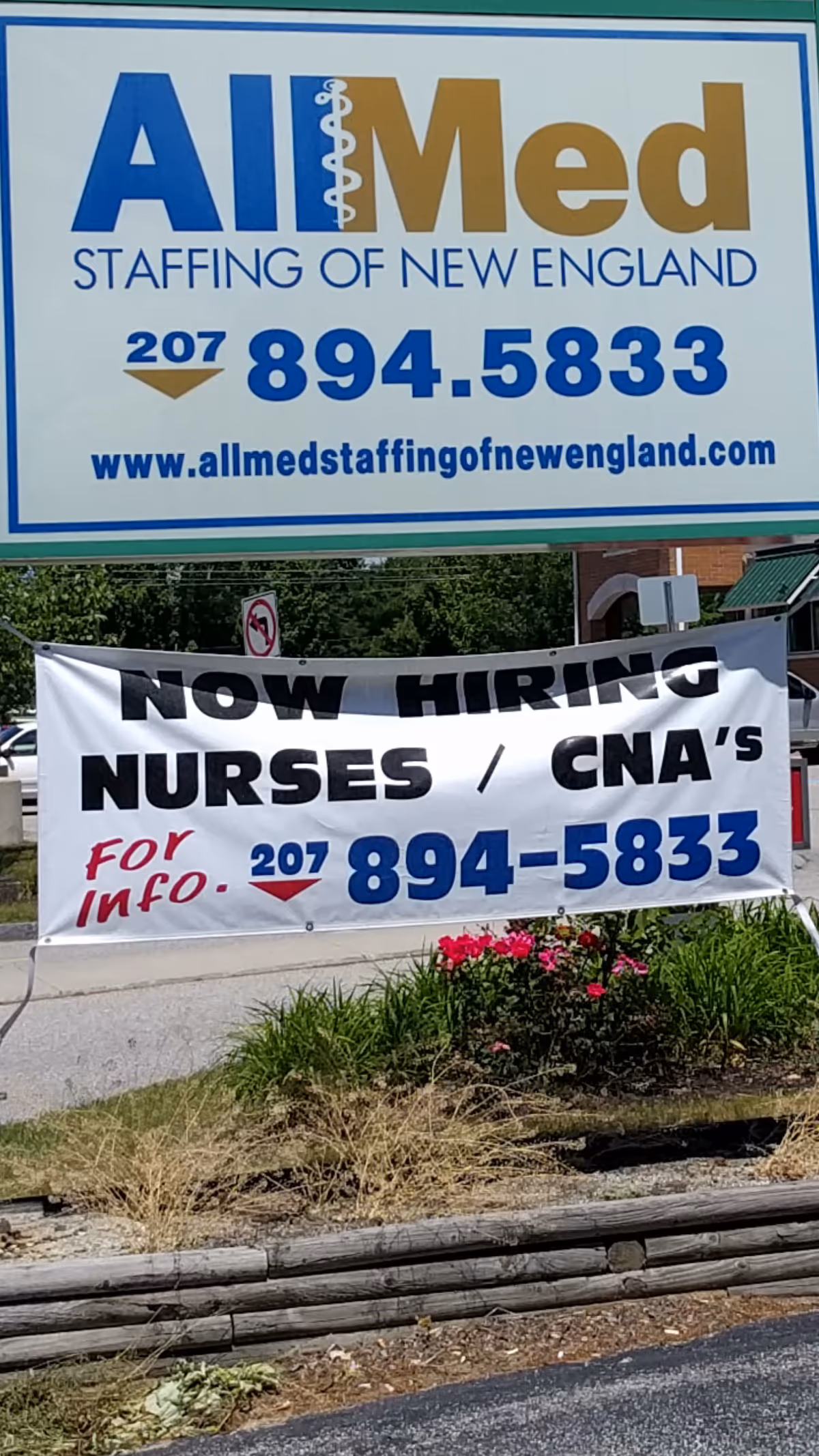Outdoor signage for AllMed Staffing of New England with a Now Hiring banner.