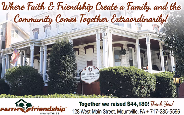 Front exterior of a large white Victorian-style senior living home with a wraparound porch, shrubs, and a Faith Friendship Villa sign.
