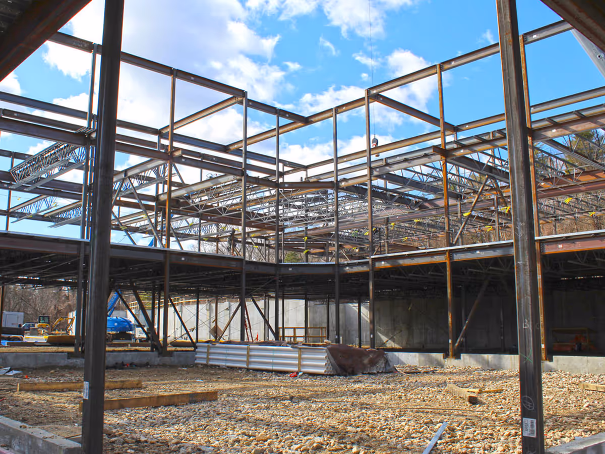 Steel structural frame of a building under construction at Bowman Place site.
