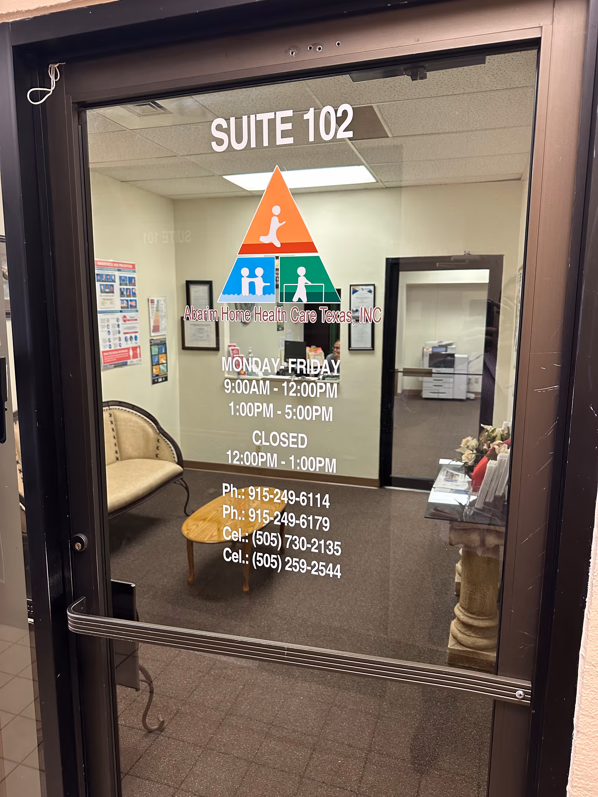 Glass door displaying Suite 102 and the Abarim Home Health Care Texas logo; interior lobby.