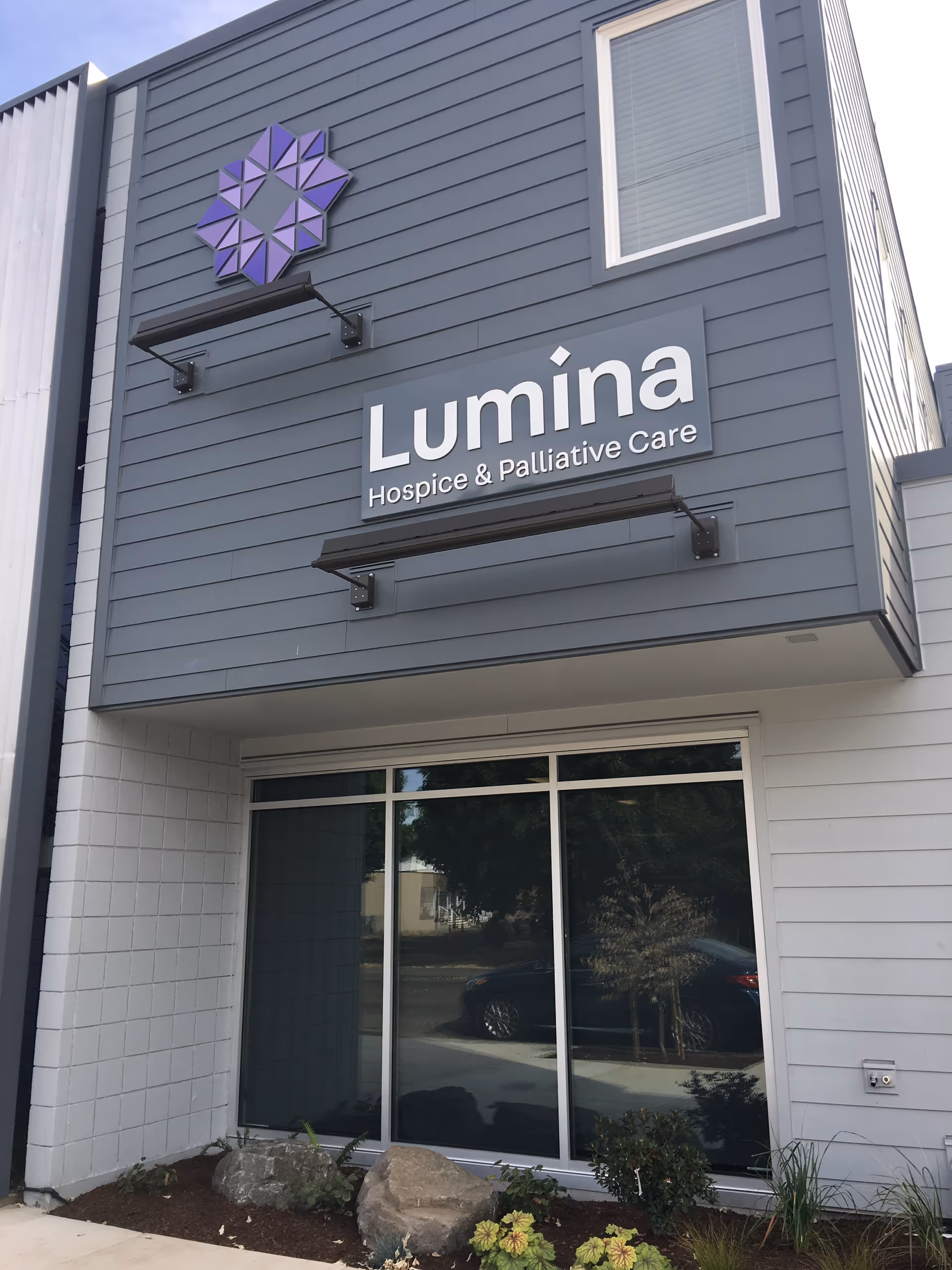Exterior view of Lumina Hospice & Palliative Care building with sign