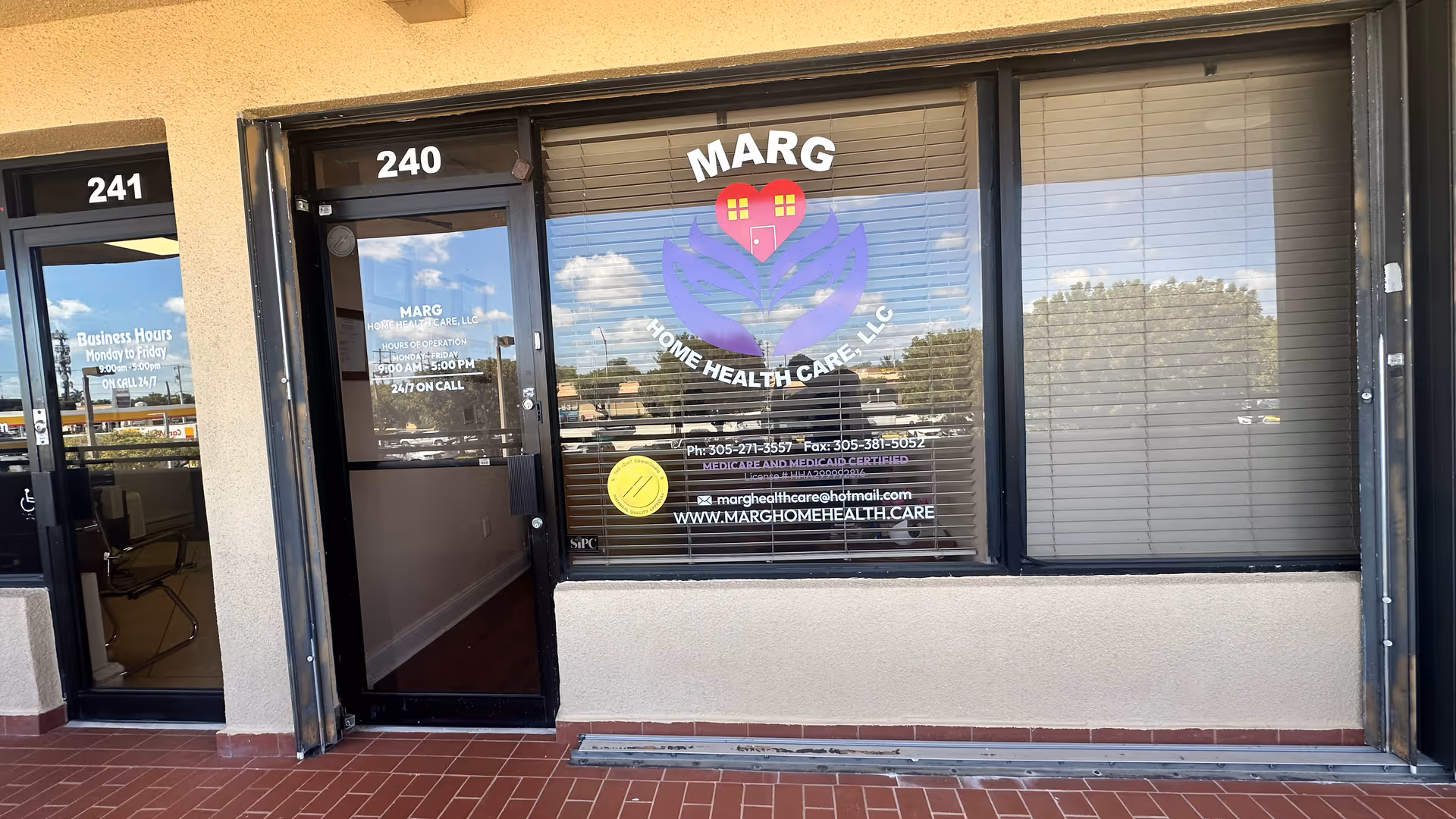 Beige storefront with glass door and large Marg Home Health Care logo on window.