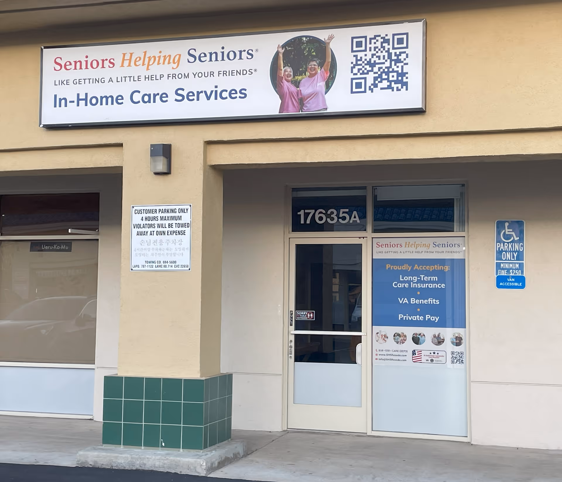 Exterior of a Seniors Helping Seniors facility with entrance and signs
