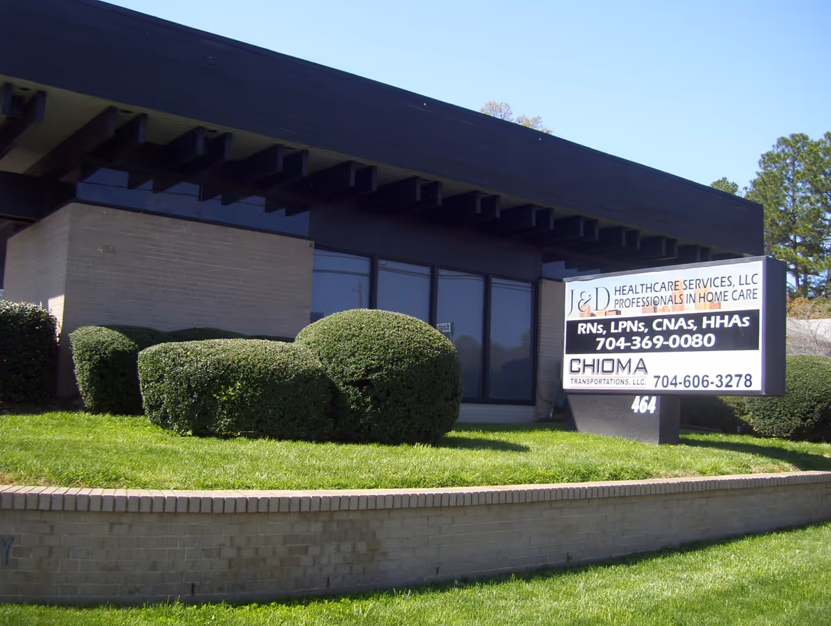 Exterior view of a facility building with a sign for J & D Healthcare Services.