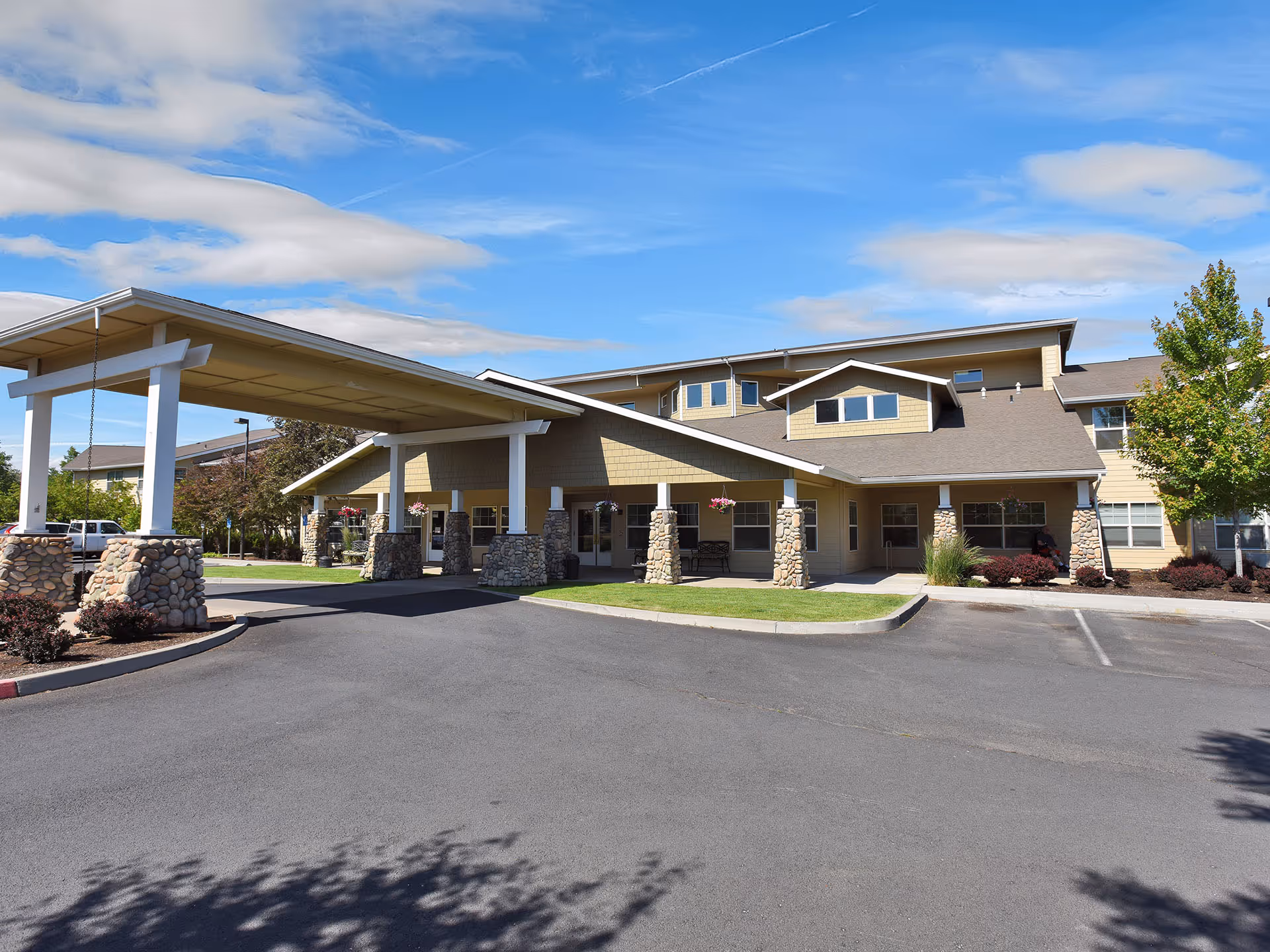 Front exterior of Prestige Senior Living High Desert featuring a covered entrance.