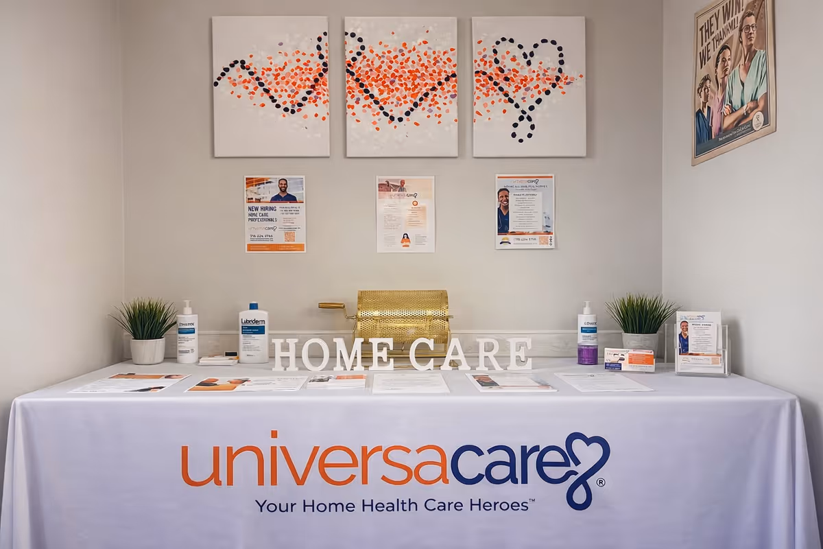 Reception desk with UniversaCare branding, home care sign, and printed materials.
