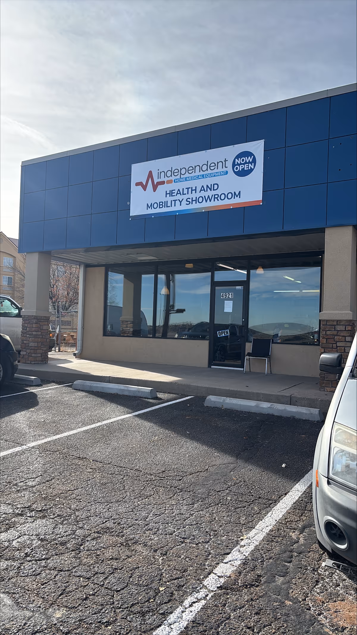 Blue storefront with Independent Health and Mobility Showroom sign and large display windows.
