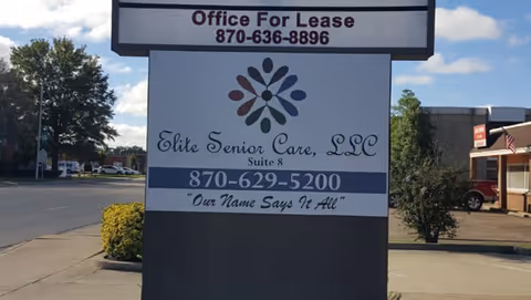Outdoor street sign for Elite Senior Care, LLC with contact numbers and lease info.
