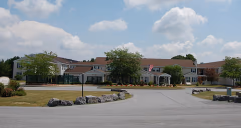 Exterior view of Brookdale Clinton with circular driveway and low buildings.