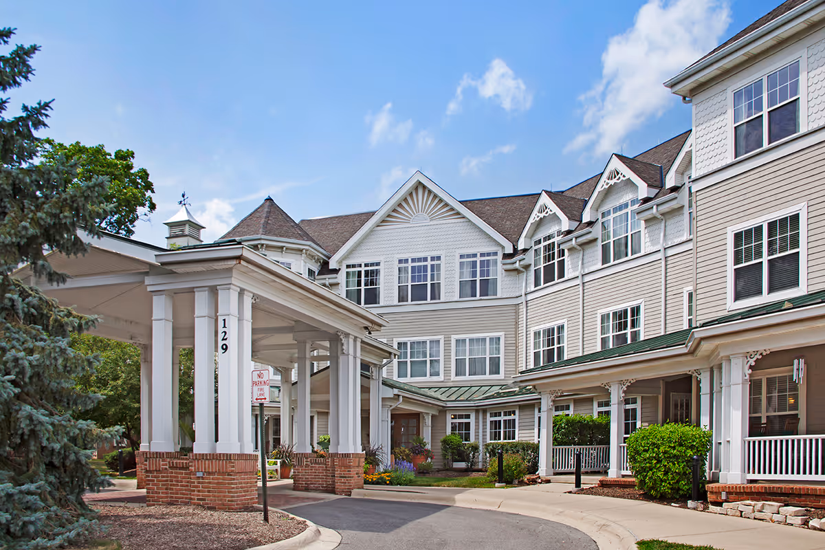 Sunrise of Bloomingdale senior living building with covered entrance and manicured landscaping.