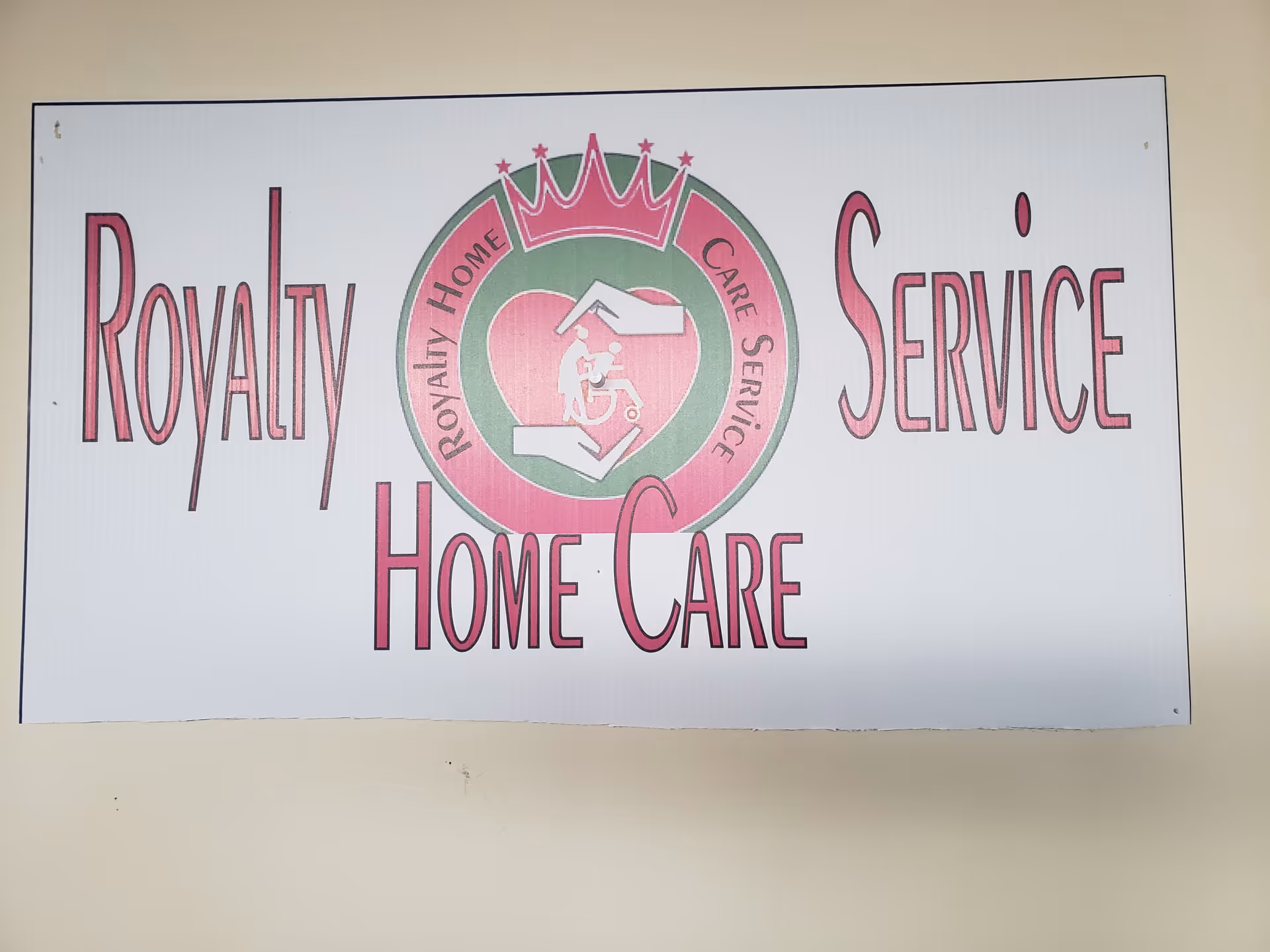 Large interior wall sign reading 'Royalty Home Care Service' with a circular logo.