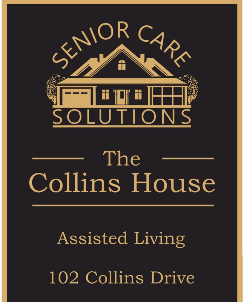 Black sign with gold text and a house logo reading Senior Care Solutions The Collins House.