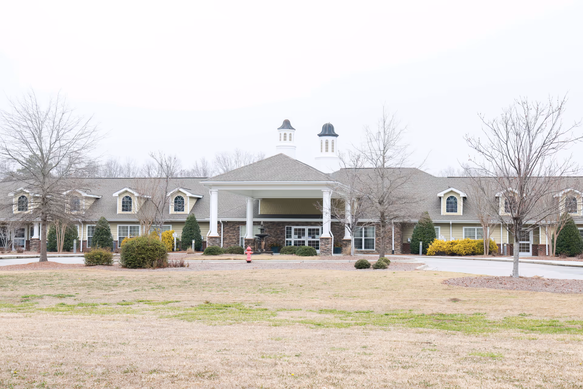 Exterior view of Scottish Pines Rehabilitation and Nursing Center with a central entrance.