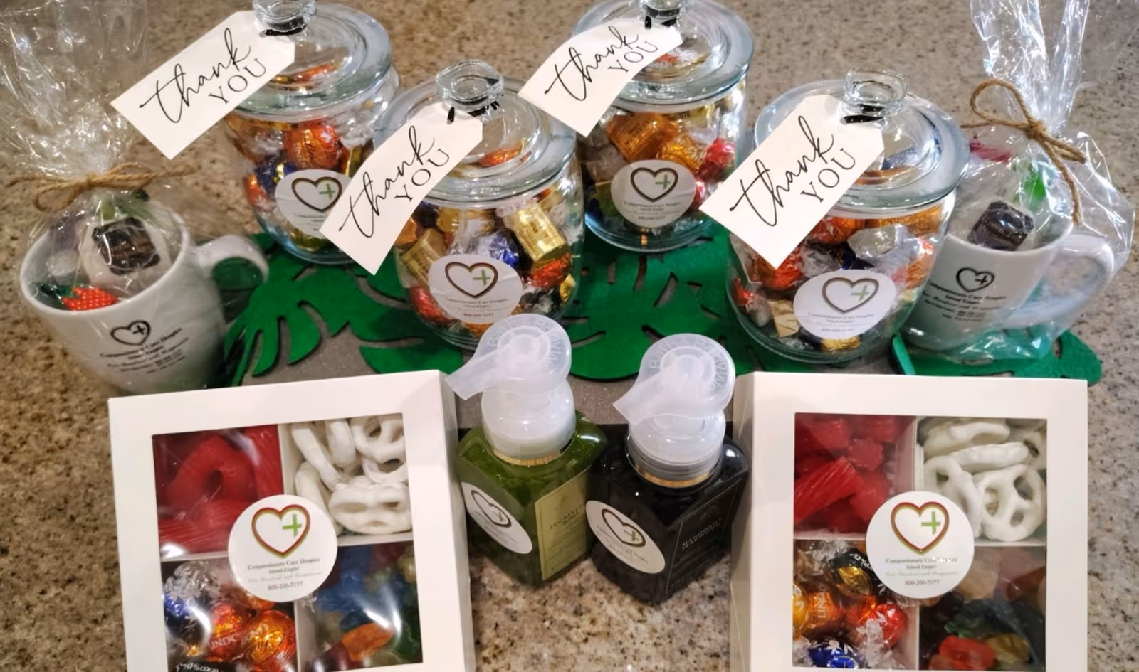 Assorted gift jars, boxes, and hand soap arranged on a counter in a hospice facility.