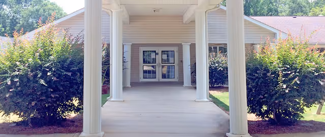 Covered walkway with columns leads to the Brookstone Terrace of Woodruff entrance.