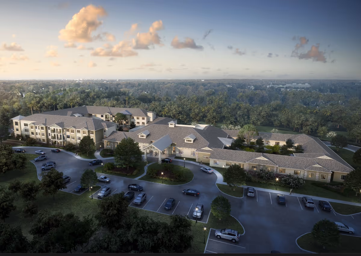 Aerial view of Village Veranda at Lady Lake, a sprawling senior living campus with parking.