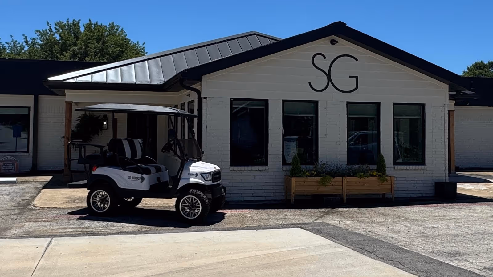Exterior view of a CareBuilders at Home Prosper facility with a golf cart outside.