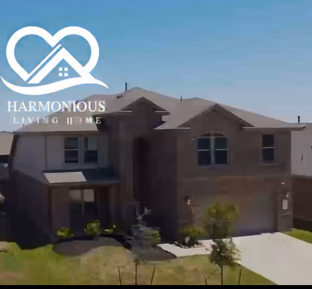 Front exterior of a residential senior living home with Harmonious Living Home logo.
