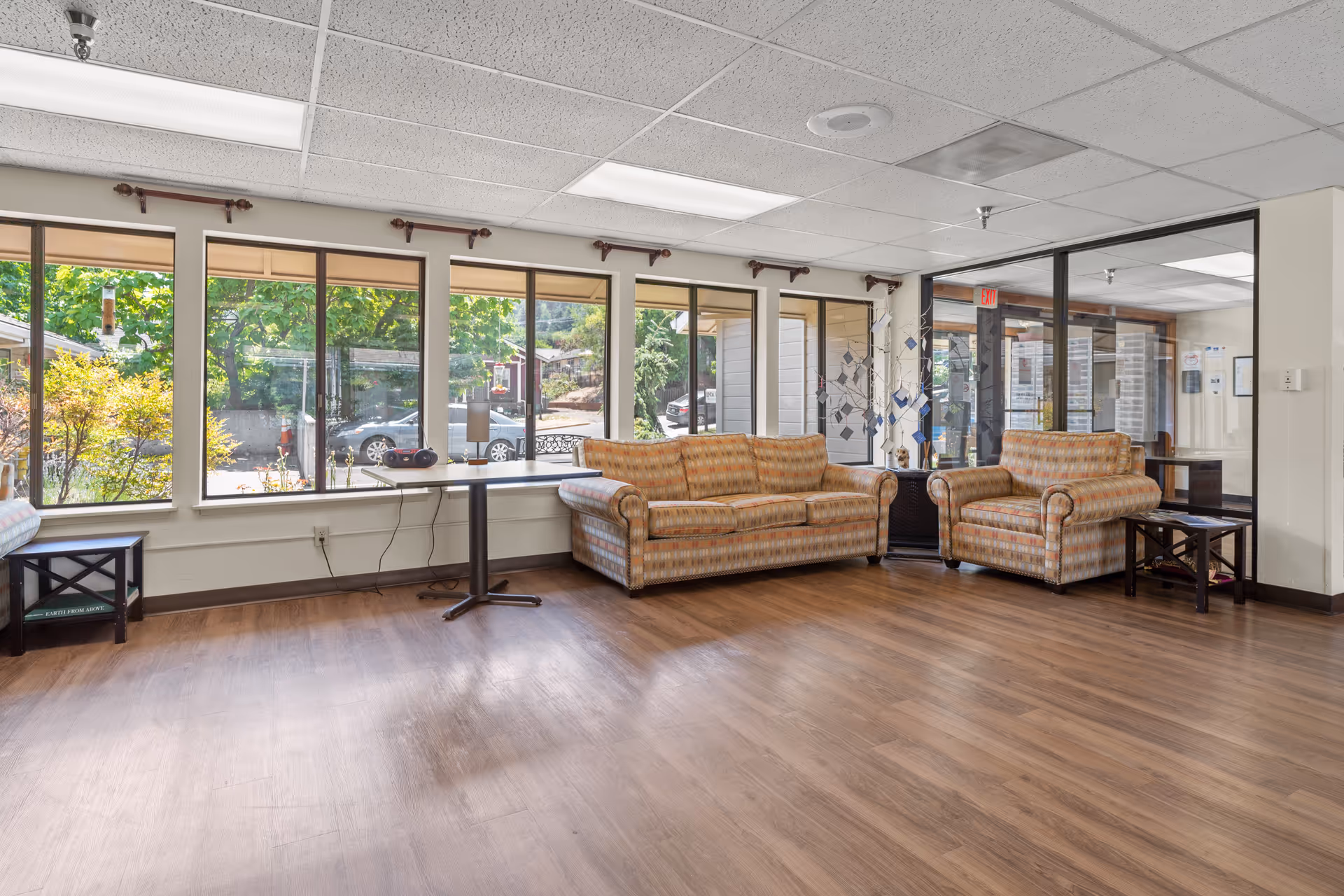 Linda Vista Nursing and Rehab Center lobby with beige sofas and sunny windows.