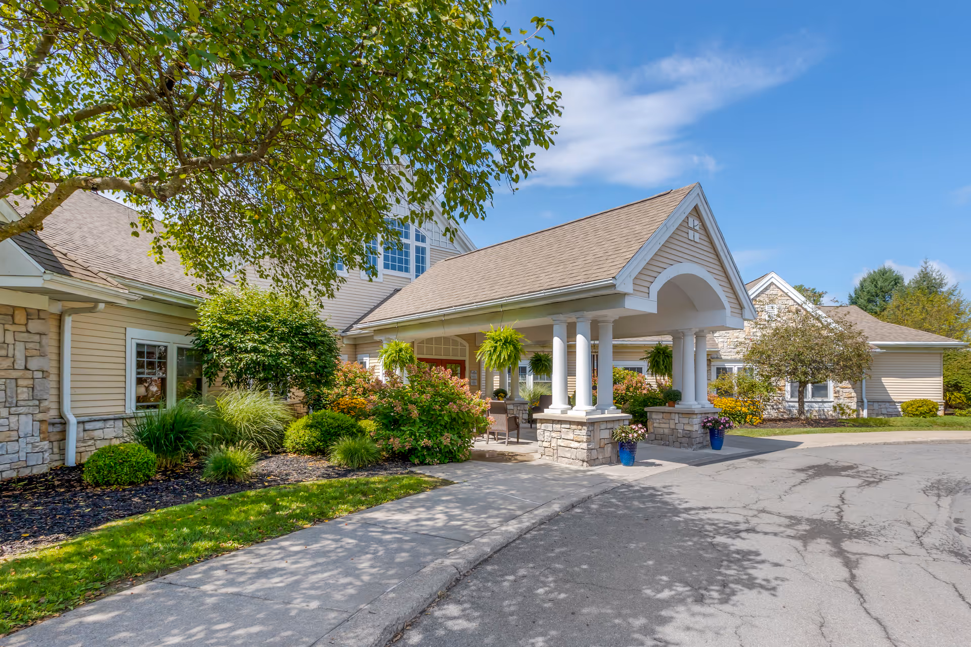 Brookdale Fayetteville exterior entrance with a covered portico and landscaped front garden.