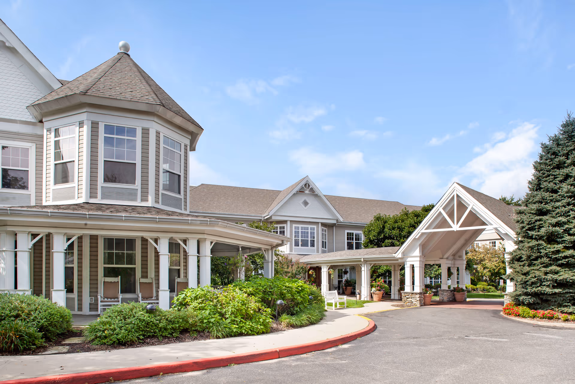 Exterior view of Sunrise of Holbrook with covered entrance and well-kept landscaping.